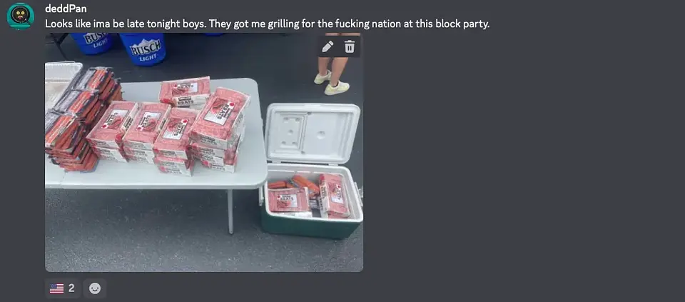 deddPan's block party table and cooler piled with grilling supplies